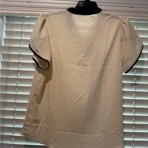 Elegant Cream Blouse with Black Trim
